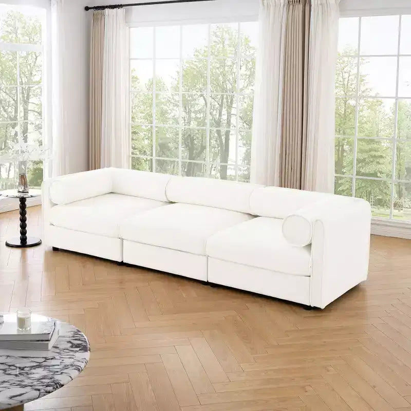 Élégant canapé blanc en chenille avec assise de rangement, dossier et accoudoirs cylindriques