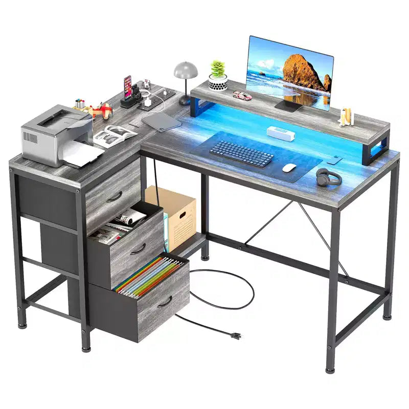 Bureau d'ordinateur de 43 pouces, bureau en L avec prises de courant et lumières LED, bureau de jeu à 3 tiroirs avec étagères de rangement et support d'écran